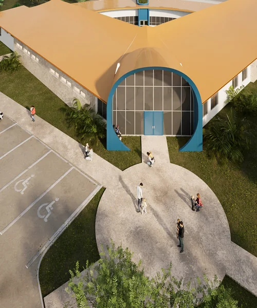 Aerial view of the center's covered entrance canopy, walkway and parking area, with families arriving